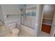 Cozy bathroom with shower, bathtub, toilet and a bright window for plenty of light at 1509 Logan St, Durham, NC 27704