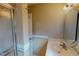 Bathroom featuring a shower, sink, and cabinet with gold accents at 1509 Logan St, Durham, NC 27704