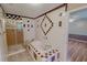 Bathroom featuring tiled walls, shower, soaking tub, and decorative accents at 1509 Logan St, Durham, NC 27704