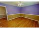 Bedroom with hardwood flooring, fan and neutral walls, creating a cozy atmosphere at 1509 Logan St, Durham, NC 27704