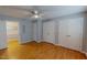 Spacious bedroom featuring hardwood floors and a ceiling fan for comfortable living at 1509 Logan St, Durham, NC 27704