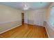 Bedroom with hardwood floors, closet, and lots of natural light, offering a relaxing retreat at 1509 Logan St, Durham, NC 27704