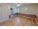 Spacious bedroom with light hardwood floors and neutral wall colors provides a welcoming space at 1509 Logan St, Durham, NC 27704