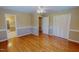 Spacious bedroom with hardwood floors and closet, providing ample storage and natural light at 1509 Logan St, Durham, NC 27704