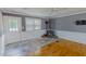 Living room featuring a wood burning stove, tile flooring and large windows at 1509 Logan St, Durham, NC 27704