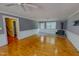 Hardwood floors accent this expansive living area, with a cozy fireplace and ample space at 1509 Logan St, Durham, NC 27704