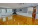 Large living area features hardwood floors, wood burning stove, and natural light at 1509 Logan St, Durham, NC 27704