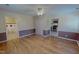 A cozy living room with hardwood floors and easy access to the kitchen and bathroom at 1509 Logan St, Durham, NC 27704