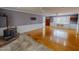 Spacious living room with hardwood floors, a fireplace, and lots of natural light at 1509 Logan St, Durham, NC 27704