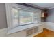 Charming window seat with built-in storage, adding character and functionality to the living space at 1509 Logan St, Durham, NC 27704