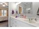Bright bathroom features -and- sinks and large vanity with tile floor at 151 Donnibrook, Fuquay Varina, NC 27526