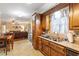 Kitchen view looking into open dining area with hardwood floors and bright view at 151 Donnibrook, Fuquay Varina, NC 27526