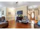 Warm and inviting living room with hardwood floors, a TV, and a comfortable seating arrangement near the front door at 151 Donnibrook, Fuquay Varina, NC 27526
