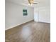 Bright bedroom featuring wood floors and closet at 1522 Goodwin Rd, Durham, NC 27712