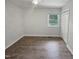 Bedroom with neutral carpet, closet and window at 1522 Goodwin Rd, Durham, NC 27712