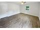 Bedroom with fresh paint, vinyl floors, and a window at 1522 Goodwin Rd, Durham, NC 27712