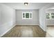 Dining room features hardwood floors, a bay window and wainscotting at 1522 Goodwin Rd, Durham, NC 27712