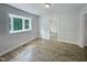 Neutral dining room with natural light and vinyl flooring at 1522 Goodwin Rd, Durham, NC 27712