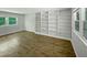 Bright living room featuring wood floors and built-in shelves at 1522 Goodwin Rd, Durham, NC 27712