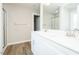 Modern bathroom featuring double vanity, chrome faucets, quartz countertop, framed mirror and tile floor at 160 Tupelo Dr, Spring Hope, NC 27882