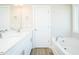 Bathroom featuring a double vanity, modern fixtures, tile floor, and separate bathtub at 160 Tupelo Dr, Spring Hope, NC 27882