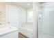 Bright bathroom with a bathtub and separate glass shower, plus a white vanity at 160 Tupelo Dr, Spring Hope, NC 27882