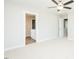 Bedroom featuring neutral carpet and walls, with a view into the ensuite bathroom at 160 Tupelo Dr, Spring Hope, NC 27882