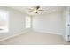 Spacious bedroom features a ceiling fan, neutral carpet and walls, and natural light from two windows at 160 Tupelo Dr, Spring Hope, NC 27882