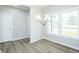 Dining room featuring hardwood floors, a modern chandelier, and lots of natural light at 160 Tupelo Dr, Spring Hope, NC 27882