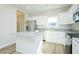Bright kitchen featuring stainless steel appliances, white cabinets, a center island, and granite countertops at 160 Tupelo Dr, Spring Hope, NC 27882