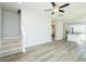 Open layout featuring the staircase and eat-in kitchen with stainless appliances at 160 Tupelo Dr, Spring Hope, NC 27882
