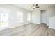 Spacious living room featuring wood-look floors, neutral walls, and a ceiling fan at 160 Tupelo Dr, Spring Hope, NC 27882
