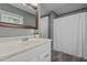 Cozy bathroom featuring a single vanity, wooden framed mirror and a shower with curtain at 1661 Reno Sharps Store Rd, Bear Creek, NC 27207