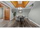 Inviting dining area with a wooden ceiling, modern table setting, and stylish decor at 1661 Reno Sharps Store Rd, Bear Creek, NC 27207