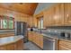 A well-lit kitchen with stainless steel appliances, ample cabinet space, and a functional kitchen island at 1661 Reno Sharps Store Rd, Bear Creek, NC 27207