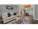 Open-concept living and dining area with elegant decor, wood accents, and plenty of natural light at 1661 Reno Sharps Store Rd, Bear Creek, NC 27207