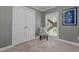 Inviting space with a chair, closet, soft carpet, natural light, and calming wall color at 1661 Reno Sharps Store Rd, Bear Creek, NC 27207