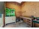 Interior view of a workshop with exposed wood framing, a workbench and storage cabinets at 1661 Reno Sharps Store Rd, Bear Creek, NC 27207