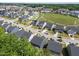 Aerial view of a residential neighborhood with well-maintained houses, streets, and manicured landscaping at 168 Amber Acorn Ave, Raleigh, NC 27603