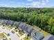 Street view showcasing well maintained homes, driveways, landscaping, and a tree-lined street at 168 Amber Acorn Ave, Raleigh, NC 27603