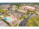 Aerial view showcasing community amenities including a pool and playground, with commercial areas nearby at 168 Amber Acorn Ave, Raleigh, NC 27603