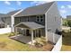 Aerial view of a backyard with a covered patio, white fence, and well-maintained lawn at 168 Amber Acorn Ave, Raleigh, NC 27603