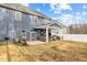 Spacious backyard with a covered patio, grill, and seating area, perfect for outdoor entertaining at 168 Amber Acorn Ave, Raleigh, NC 27603