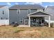The home features a covered patio with a grill, outdoor seating, and a fenced-in backyard at 168 Amber Acorn Ave, Raleigh, NC 27603