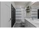 Well-lit bathroom featuring a tub with shower, dual-sink vanity, and modern fixtures at 168 Amber Acorn Ave, Raleigh, NC 27603
