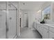 Bright bathroom with a glass enclosed shower and double sink vanity at 168 Amber Acorn Ave, Raleigh, NC 27603