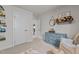 Bright bedroom with dresser, decorative wall shelf, and sitting area at 168 Amber Acorn Ave, Raleigh, NC 27603
