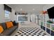 Bonus room with play area, chalkboard, and comfortable gray sofa at 168 Amber Acorn Ave, Raleigh, NC 27603