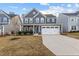 Beautiful two-story home with a well-manicured lawn and attached two-car garage at 168 Amber Acorn Ave, Raleigh, NC 27603