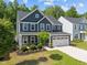 Lovely two-story home with well-kept lawn, showcasing beautiful landscaping and a two-car garage at 168 Amber Acorn Ave, Raleigh, NC 27603